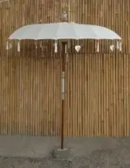 Bali umbrella, creme with metal coins and silver hearts hanging around the edge, ø 190 cm and 250cm height 